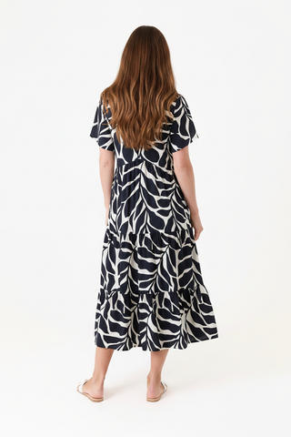Back view of the Dreams Mega Leaf Dress in black and white