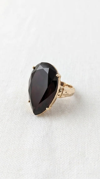 Envy stretch ring with large black teardrop stone